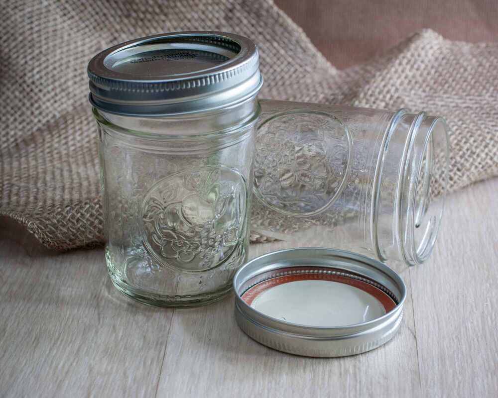 Two empty glass jars on a table