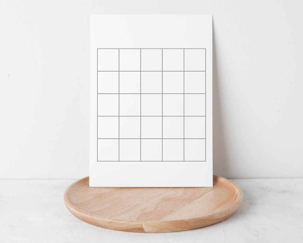 Image of a blank bingo card leaning against a wall. 