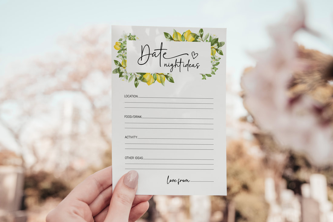 A person holding a date night ideas card with lemon border