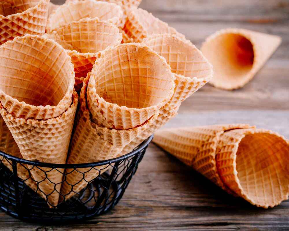 Waffle Cones Placed Neatly in a Black Wire Basket