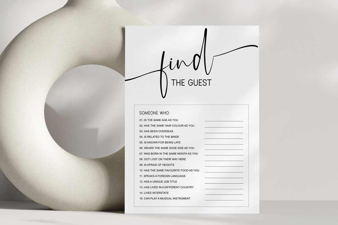 Minimalist find the guest game card leaning against a white circle vase