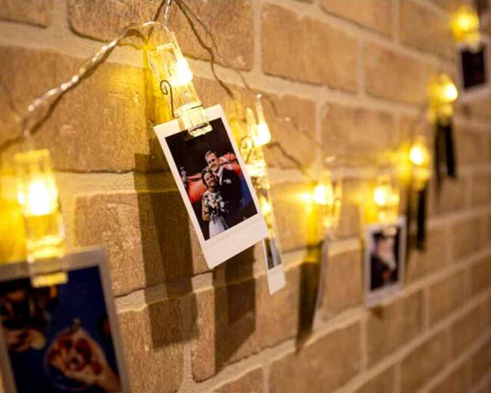 Creative Photo Display Ideas - Peg photos to fairy lights